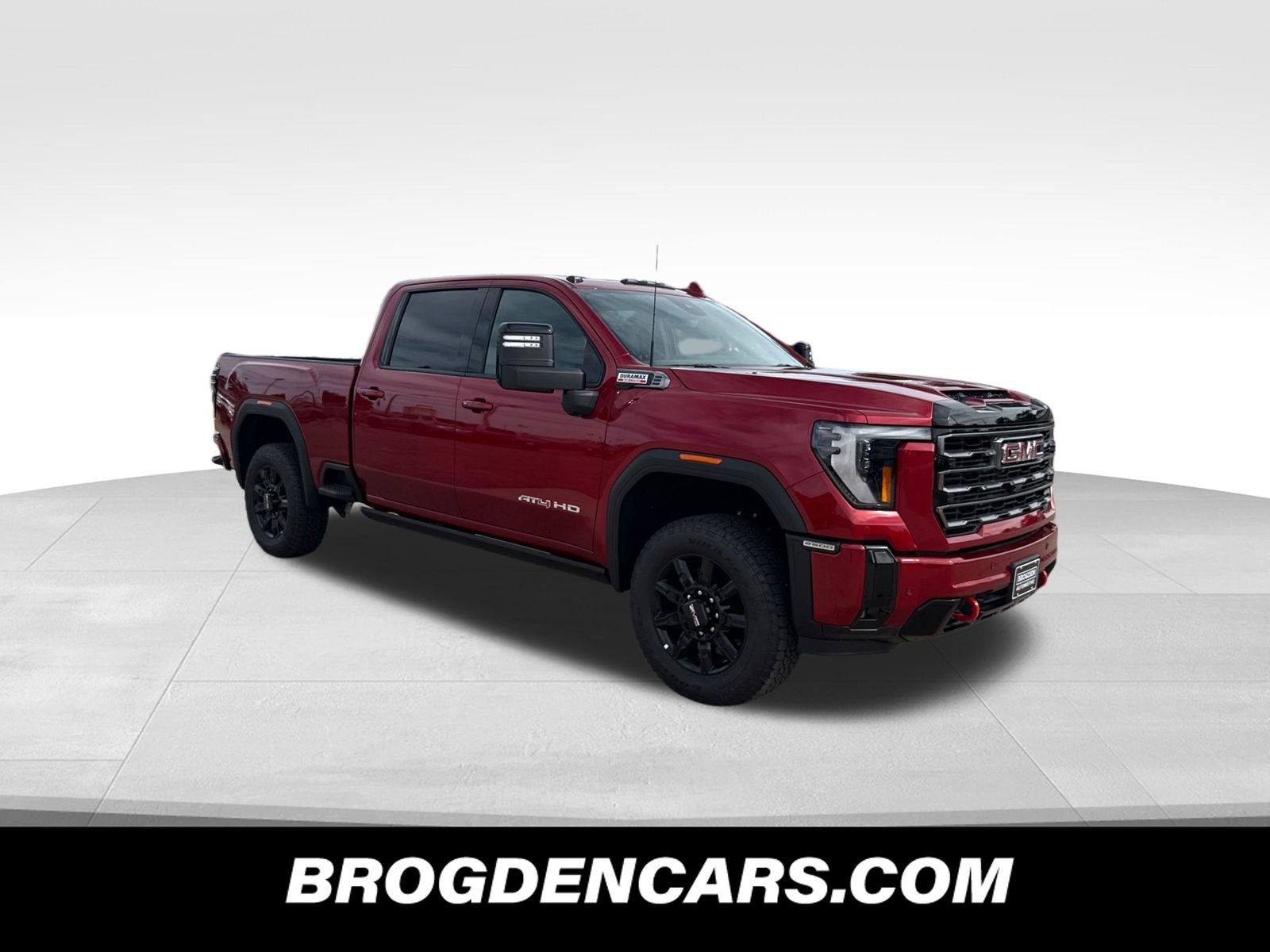 2026 GMC Sierra 2500 HD AT4 in Volcanic Red Tintcoat — front three-quarter view