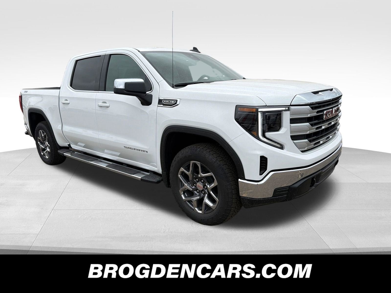 2026 GMC Sierra 1500 SLE in Summit White — front three-quarter view