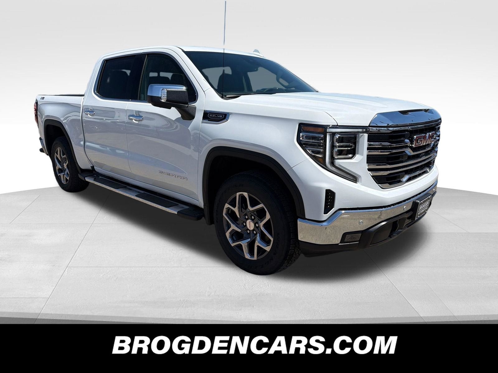 2026 GMC Sierra 1500 SLT in Summit White — front three-quarter view