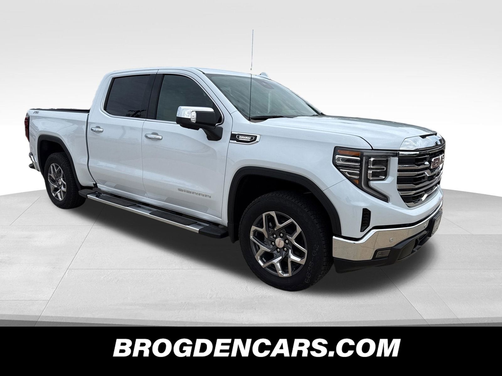 2026 GMC Sierra 1500 SLT in Glacier White Tricoat — front three-quarter view